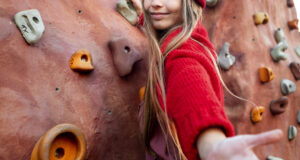 little-girl-trying-climbing-wall